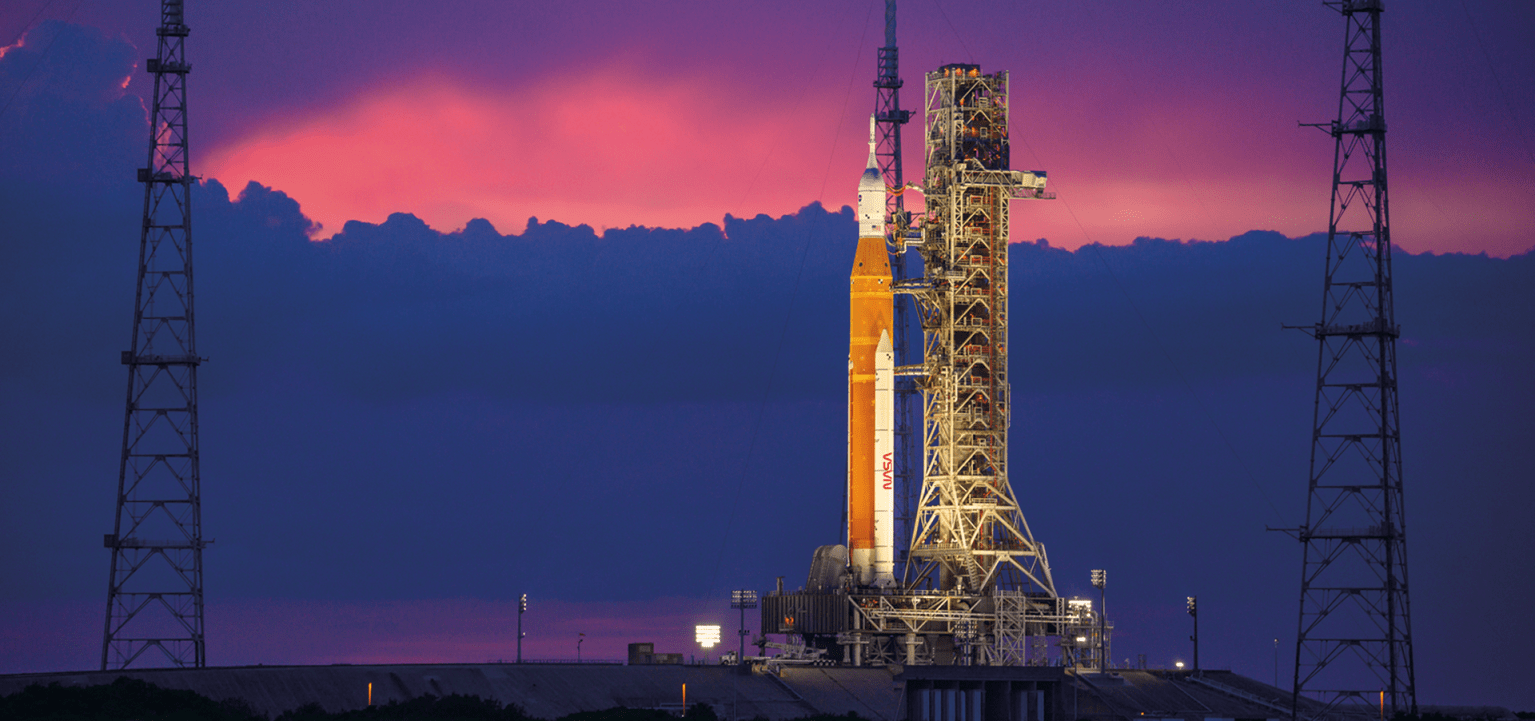 NASA’s Space Launch System (SLS) rocket, capped by the Orion spacecraft, sits on the mobile launcher at Launch Complex 39B at NASA’s Kennedy Space Center in Florida prior to the Artemis I mission. Artemis I, which launched in November of 2022, was the first integrated test of the agency’s deep space exploration systems: SLS, the Orion spacecraft, and supporting ground systems. It was also the first in a series of increasingly complex missions to the Moon.