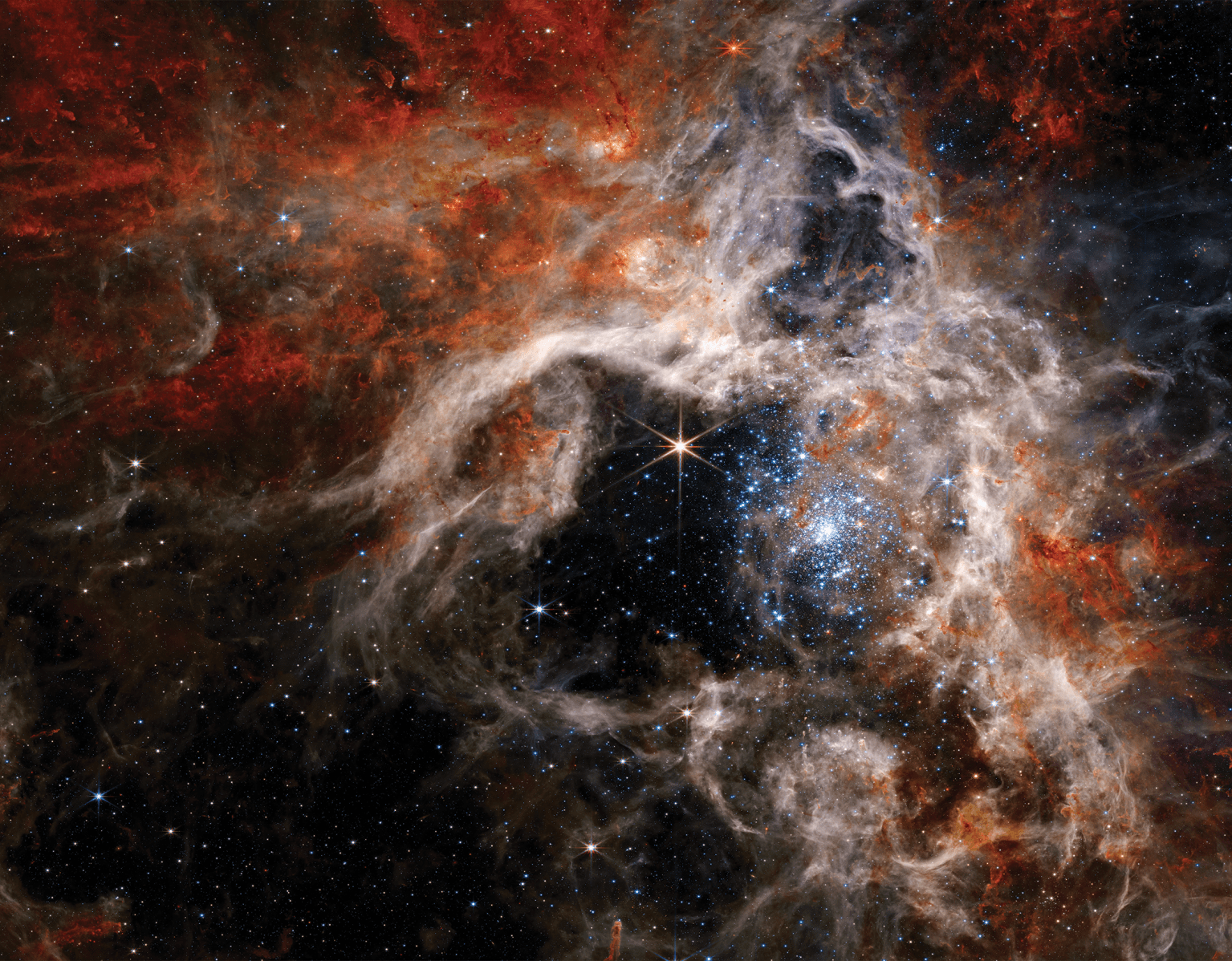 Space image wit stars n' swirlz of colorful orange, red n' white.