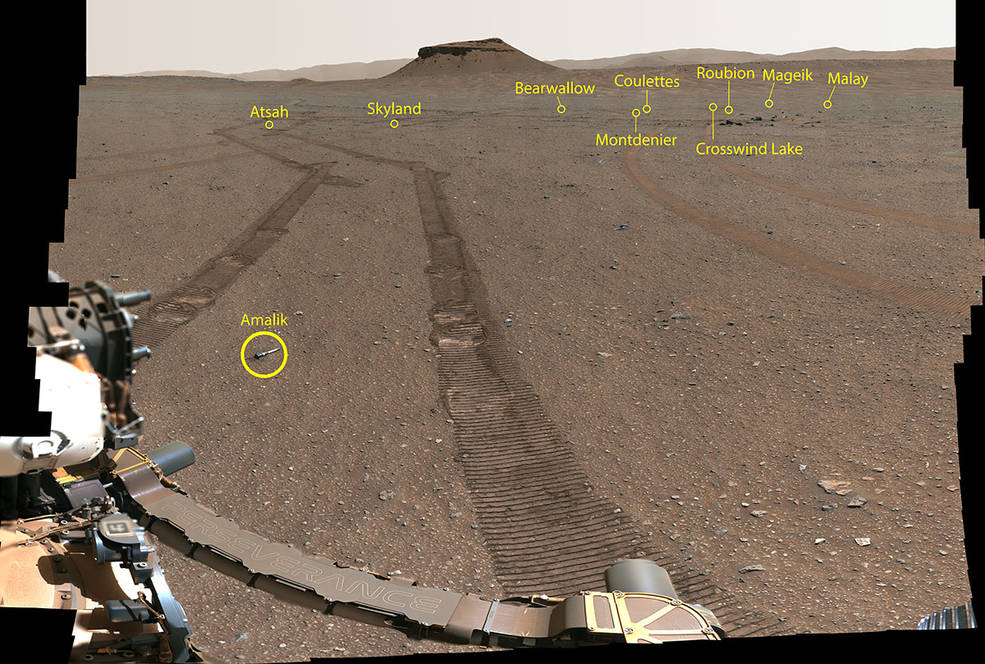 A wide angle view from the Perseverance rover overlooking a sandy landscape with shows the location of the 10 sample tubes 