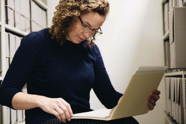 Archivist looking at a file