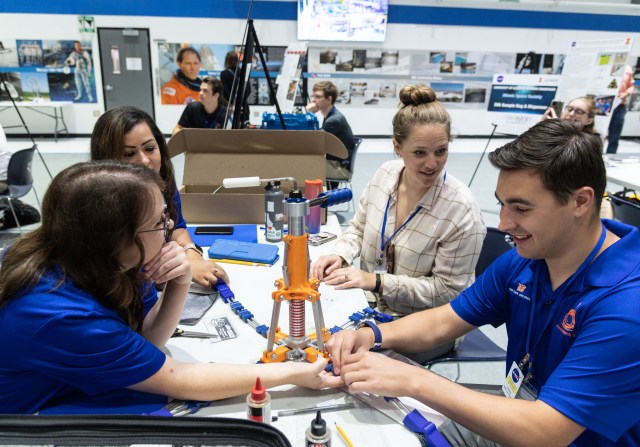 Students working together on a device