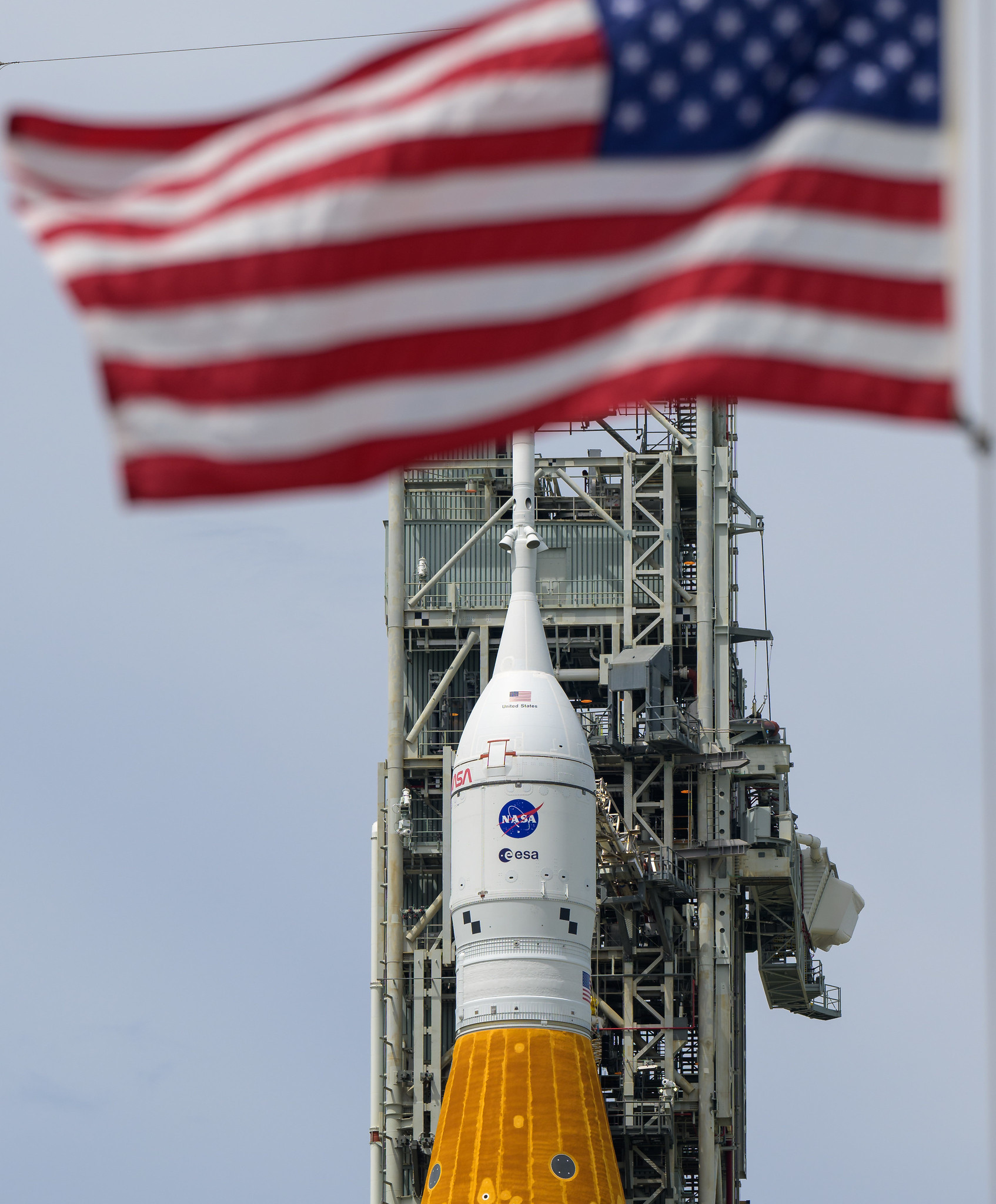 NASA’s Space Launch System (SLS) rocket with the Orion spacecraft aboard is seen atop a mobile launcher at Launch Pad 39B.