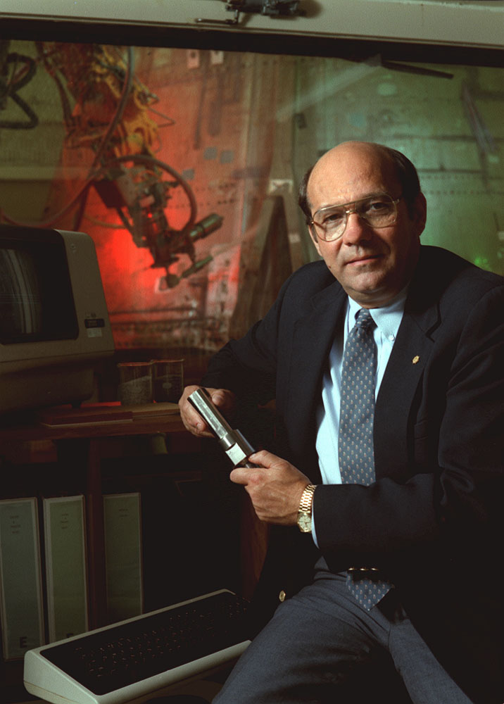 James R. Thompson in the control room of the Solid Rocket Booster automated thermal protection system removal facility. 