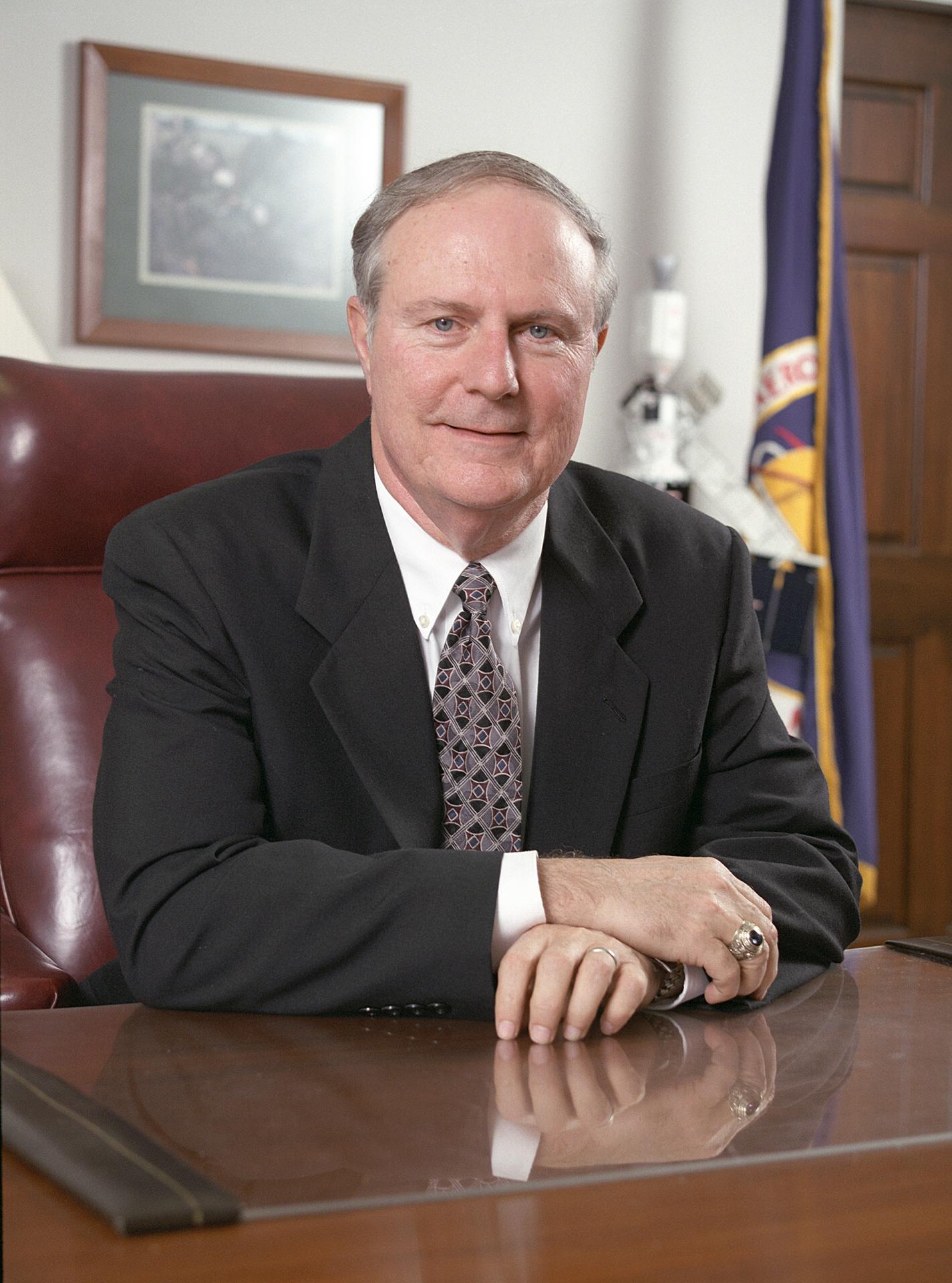 Portrait of J. Wayne Littles at his desk