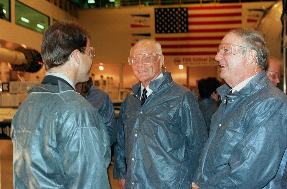 John Glenn and  Roger Bedford receive a tour of the Space Station manufacturing facility from Jerroll W. Littles.