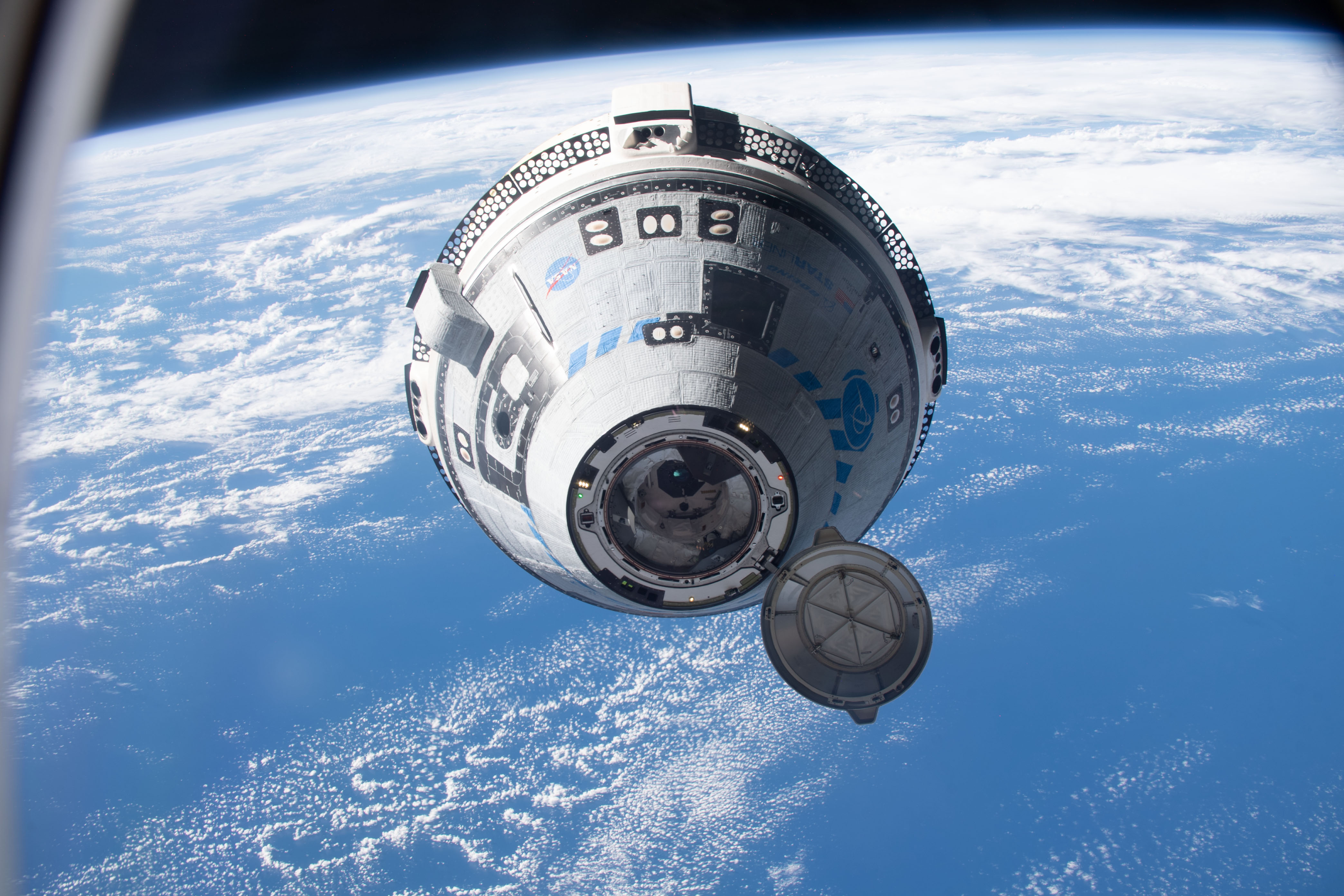 Boeing's CST-100 Starliner crew ship approaches the International Space Station on the company's Orbital Flight Test-2 mission before automatically docking to the Harmony module's forward port.