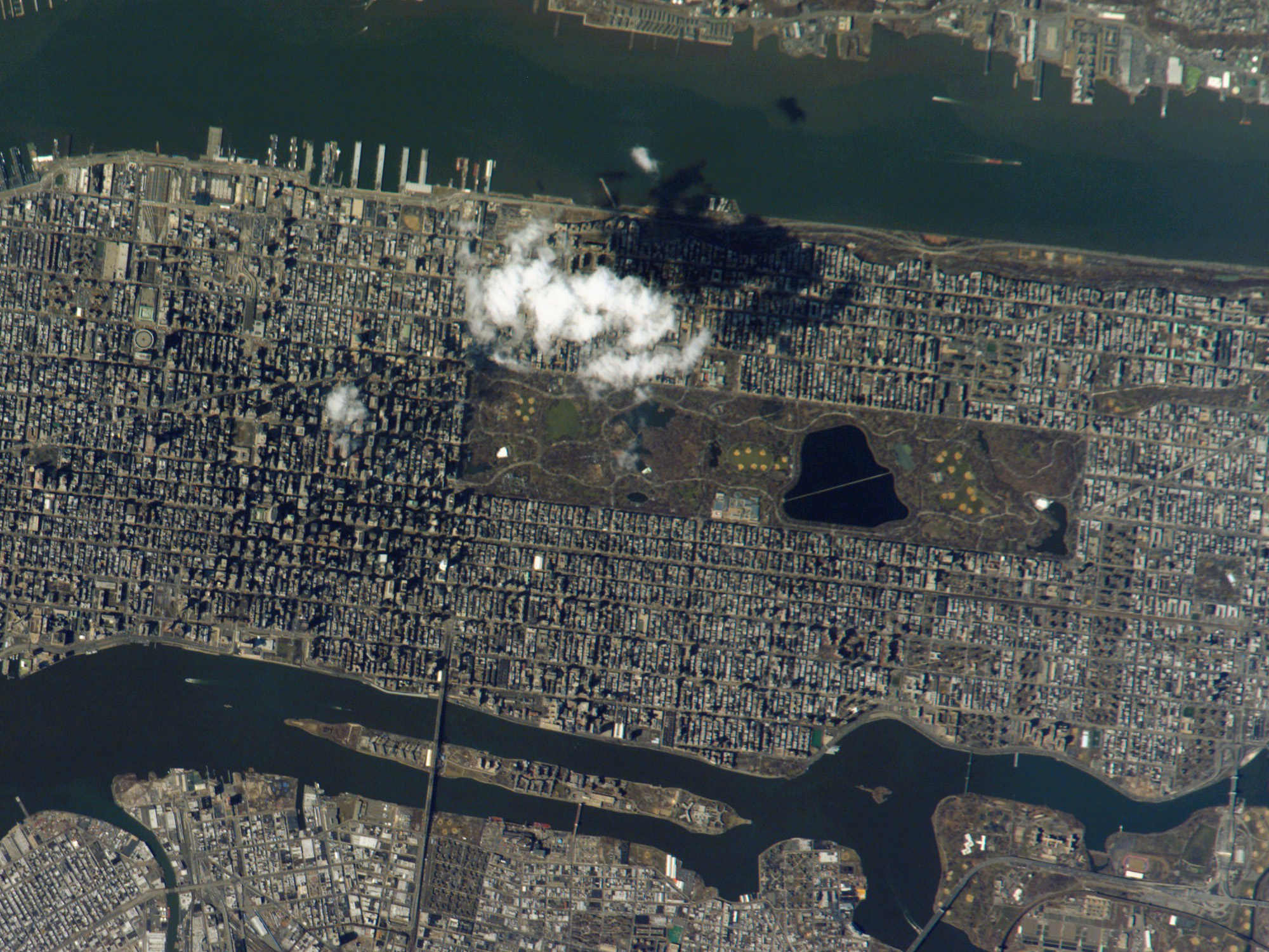 Photo of Manhattan, NYC, taken from the ISS during mission 10. NASA/GISS barely visible as one of many buildings just to the right and up from Central Park.