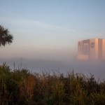 The top of the Vehicle Assembly Building visible above some fog at NASA's Kennedy Space Center in Florida.