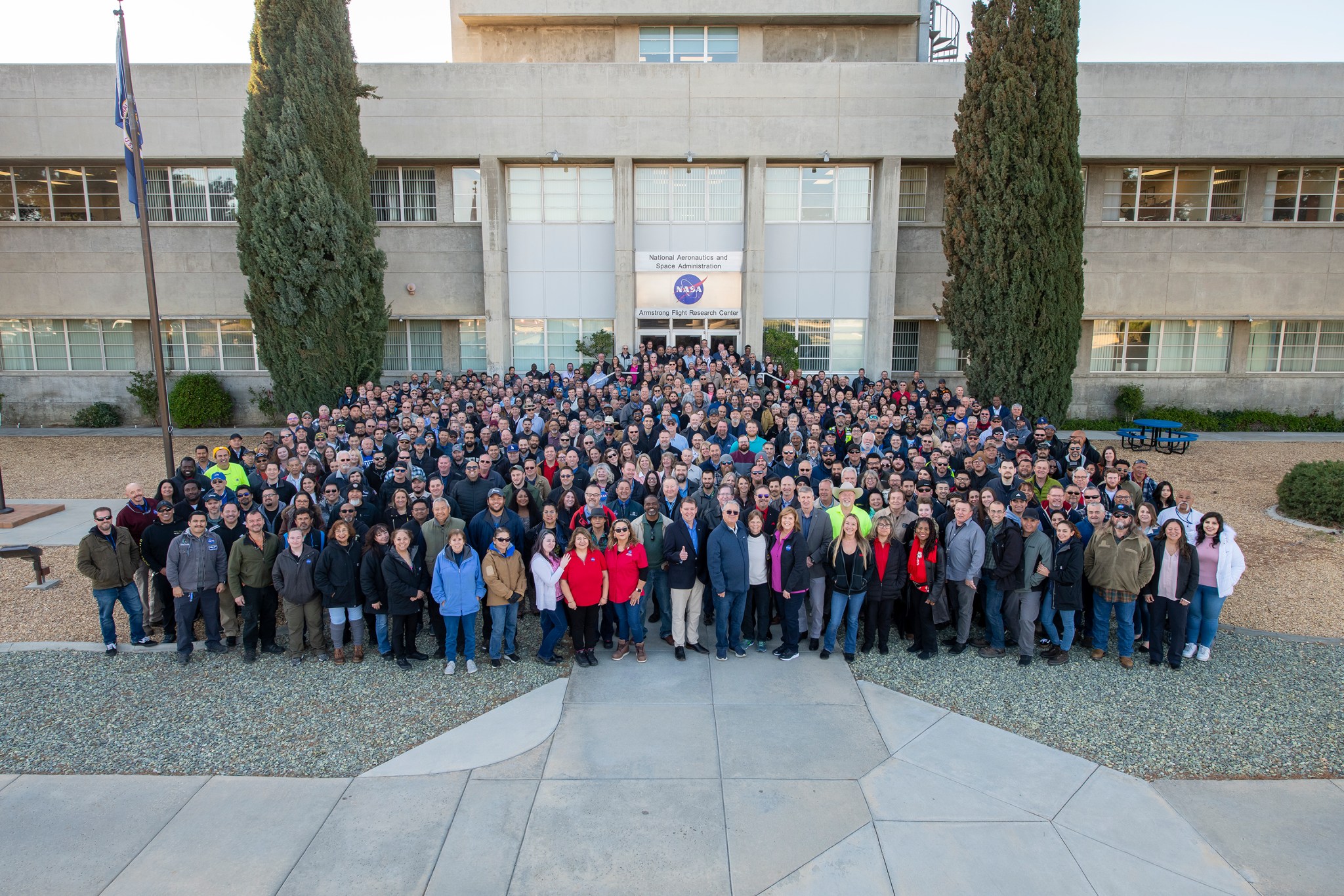 Large group of people standing in front of NASA's Armstrong Flight Research Center's main building.