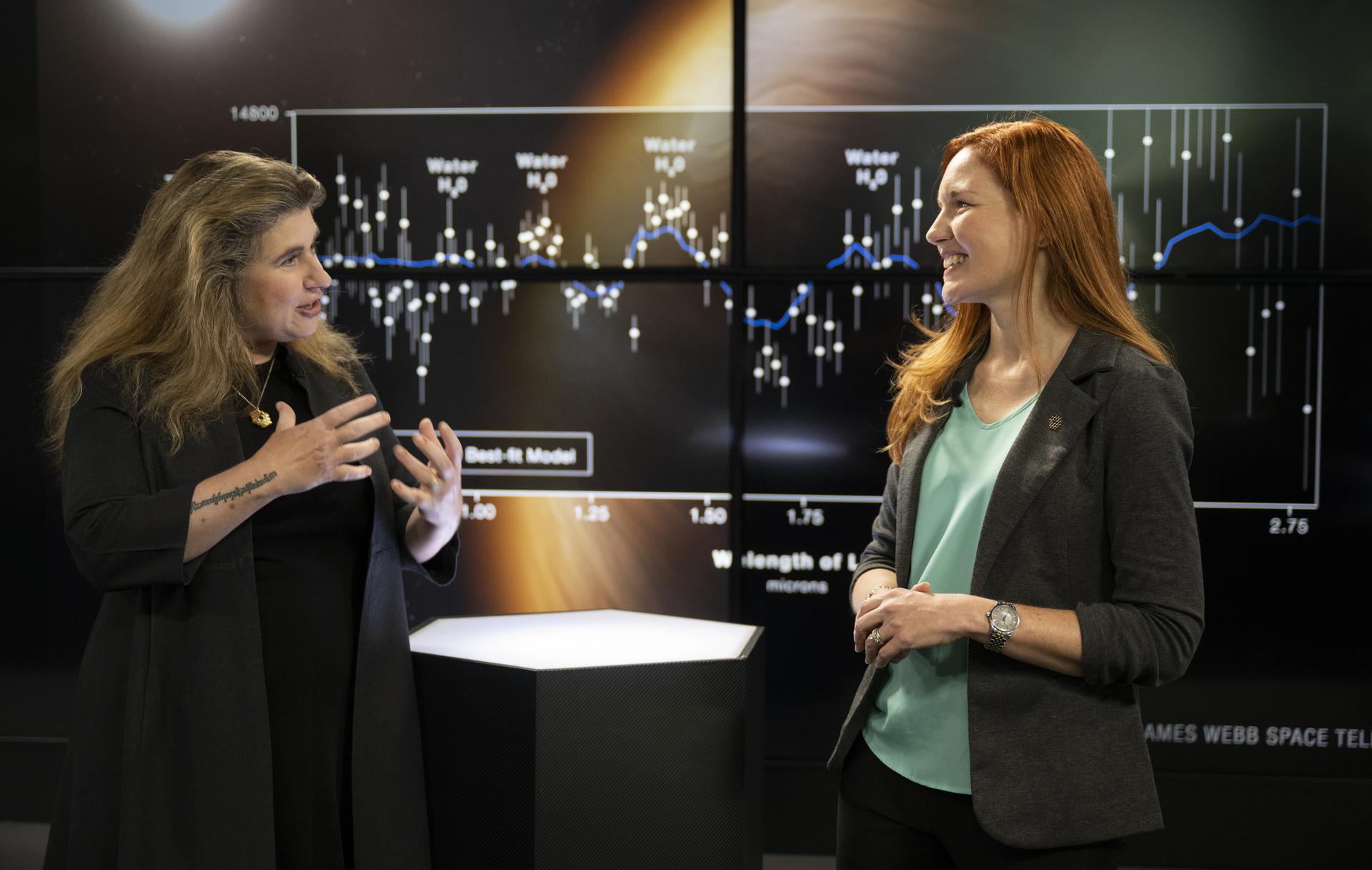 Assistant Director of Science at NASA's Goddard Space Flight Center Michelle Thaller, left, speaks with NASA James Webb Space Telescope Deputy Project Scientist for Communications Amber Straughn.