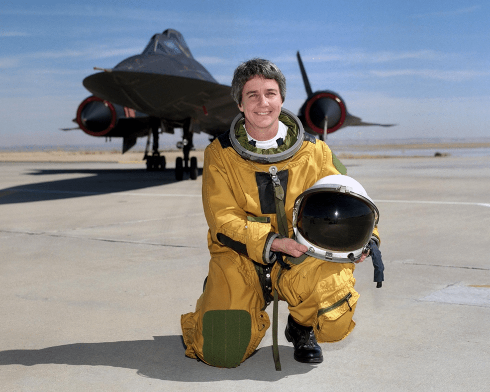 Marta Bohn-Meyer kneeling in front of her SR-71 test plane.