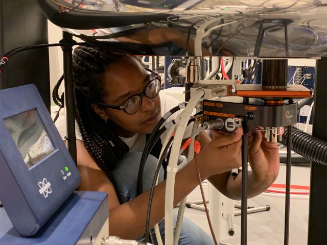 CCNY Chemical Engineering Ph.D. student Loleth Robinson performs solid-state NMR measurements on NASA JPL battery materials for the future Europa Lander.