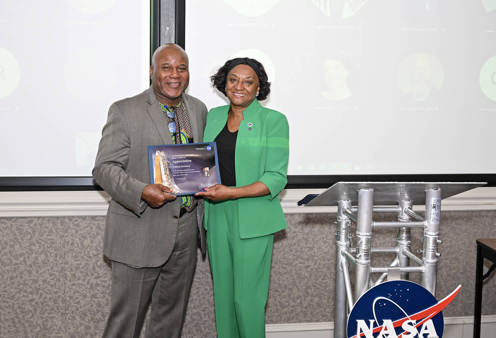 Carolyn Magsby, deputy director of Marshall Space Flight Center’s Office of Diversity u0026amp; Equal Opportunity (ODEO), presents William Hampton with a certificate of appreciation for his presentation during the Black History Month program on Feb. 22. 