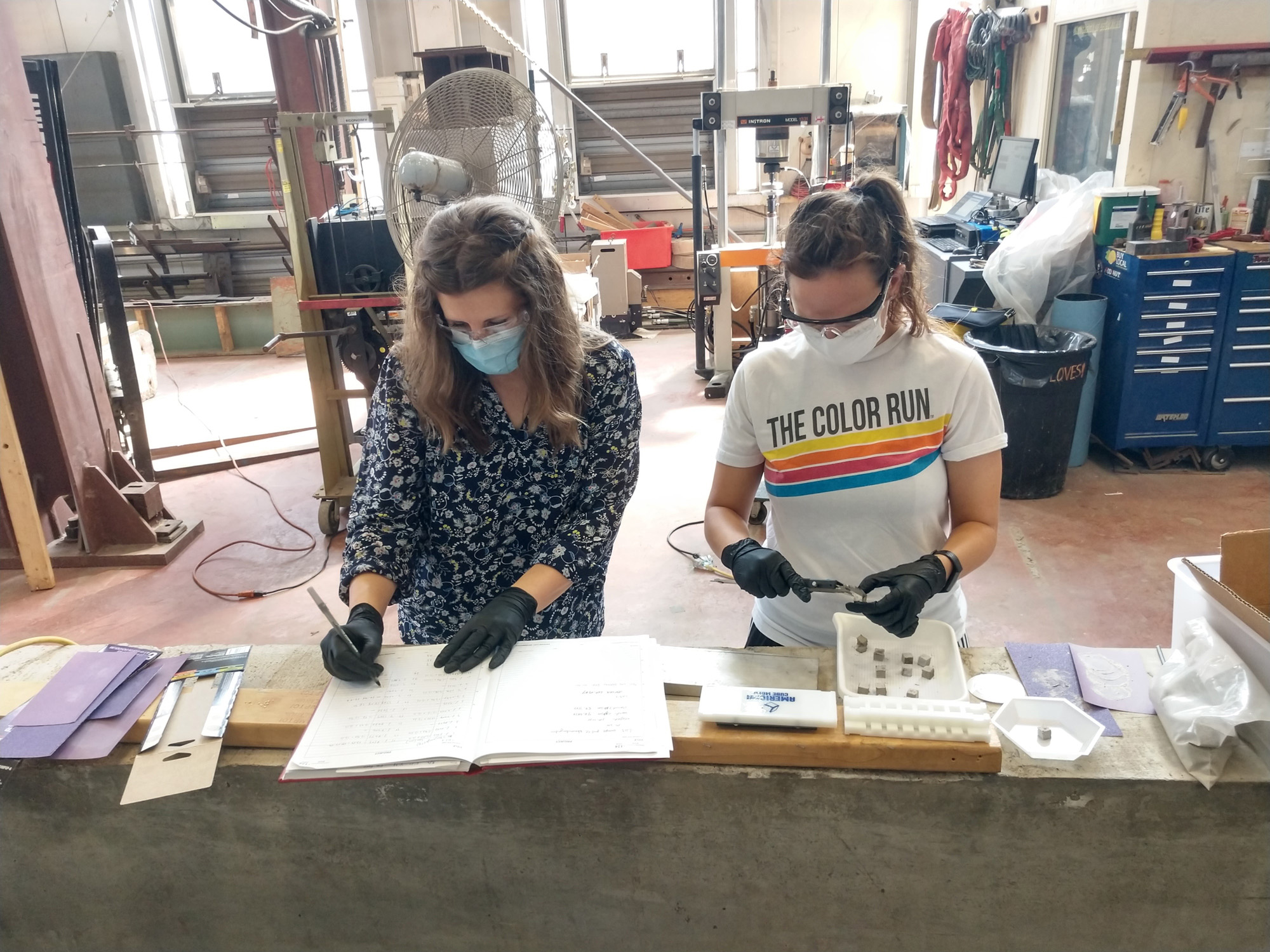 Two women work on a project in the lab