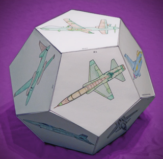 A 3-D dodecahedron made of paper featuring images of aircraft