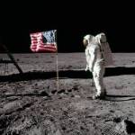 Astronaut Buzz Aldrin stands on the Moon facing a U.S. flag during the Apollo 11 mission in July 1969.