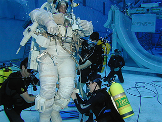 An astronaut in a spacsuit underwater