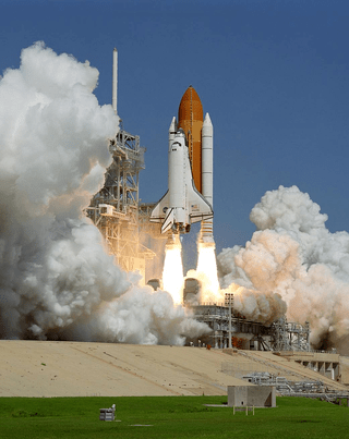 A picture of the space shuttle during takeoff