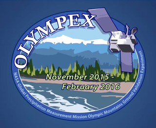 A mission patch illustration with a satellite flying past a mountainous landscape