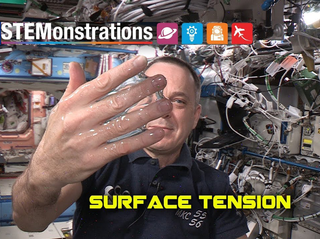 The words "STEMonstrations. Surface Tension" and an astronaut on the International Space Station holds up his hand with a bubble