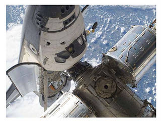 The space shuttle docking with the ISS