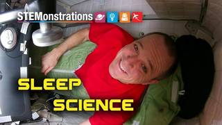 Astronaut Ricky  Arnold aboard the International Space Station and the words STEMonstration: Sleep Science