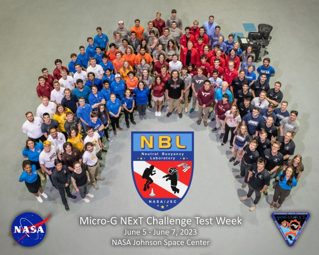 Participants in the 2023 Micro-g NExT Challenge Test Week stand in a horseshoe shape.