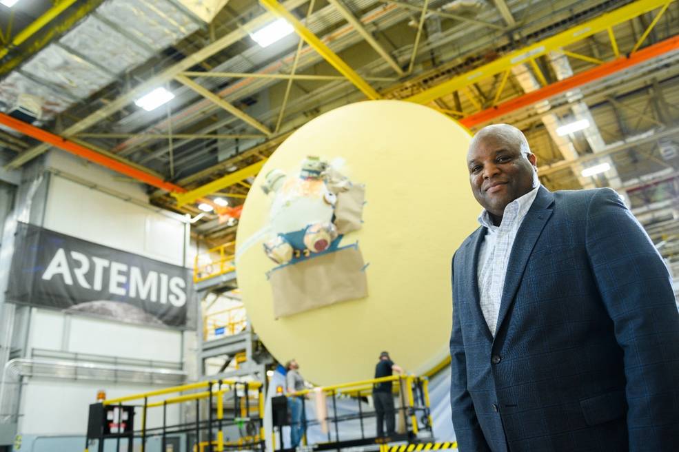 Michoud Assembly Facility Deputy Director Hansel Gill stands in front of the Space Launch System’s (SLS) core stage 2 in final assembly at Michoud.