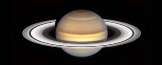 Saturn with its rings and one of them seems to be dark due to the autum or spoke season.