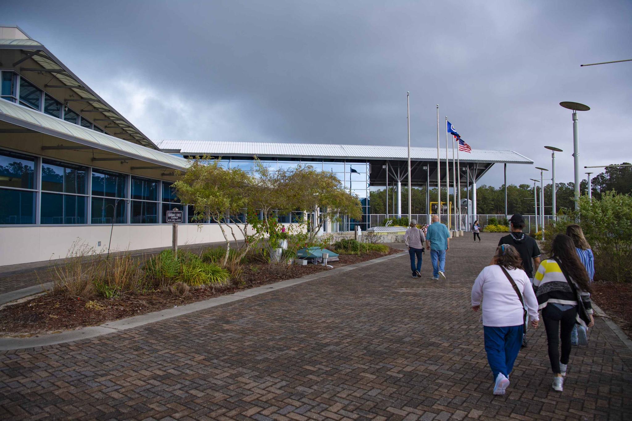 People approaching the entrance into INFINITY Science Center, the host to NASA Stennis Visitor Center