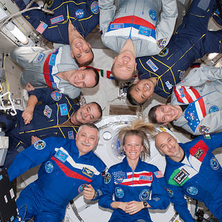 Astronauts onboard the ISS in a circle