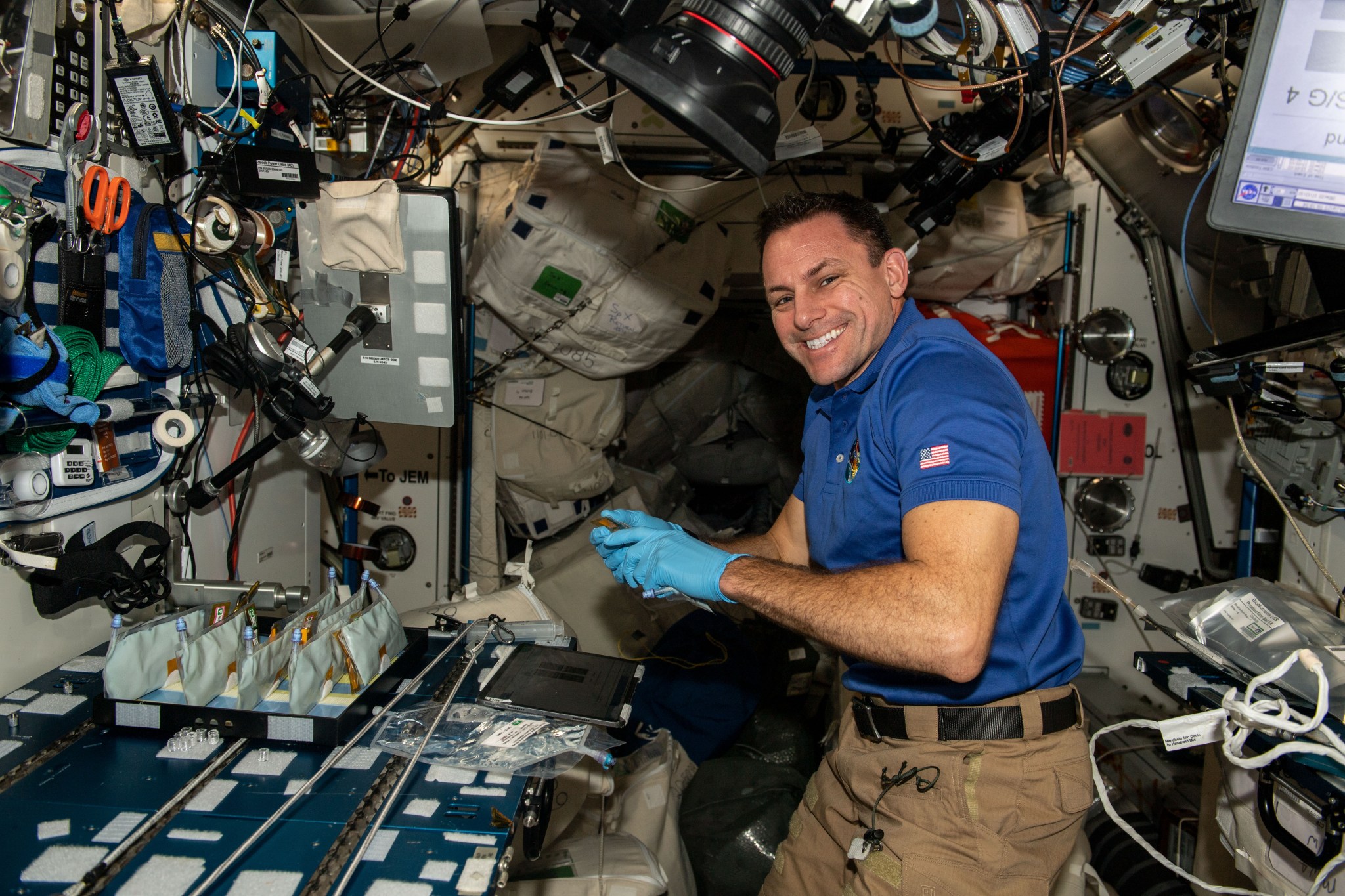 (Jan. 4, 2022) u002du002d- NASA astronaut and Expedition 68 Flight Engineer Josh Cassada works in the International Space Station's Harmony module on the BioNutrients-2 investigation.