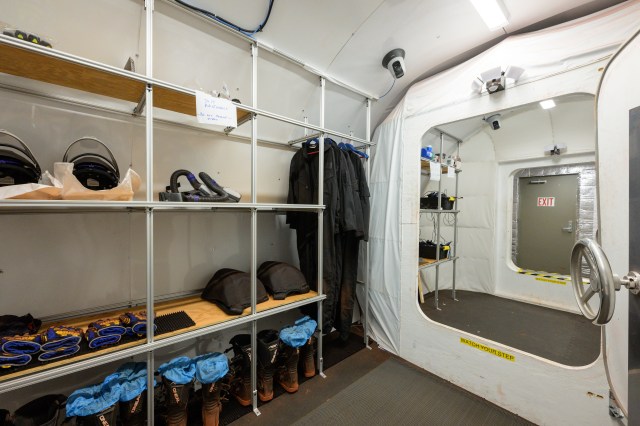 A view through the airlock, which connects the CHAPEA habitat to the sandbox area, where crew members will conduct simulated spacewalks.