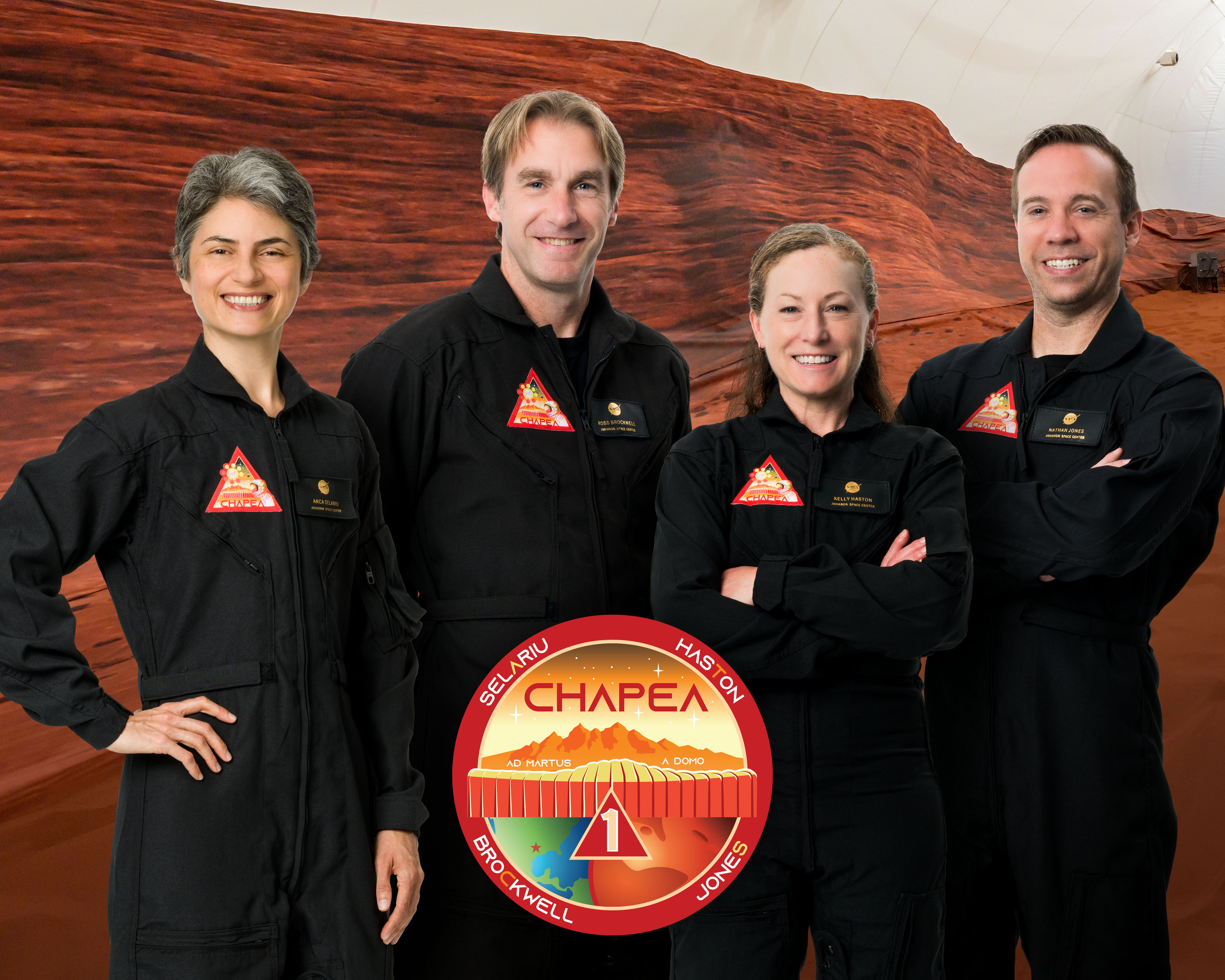 The CHAPEA Mission 1 crew with the official mission patch. (From left) Science Officer, Anca Selariu; Flight Engineer, Ross Brockwell, Commander, Kelly Haston, Medical Officer, Nathan Jones.