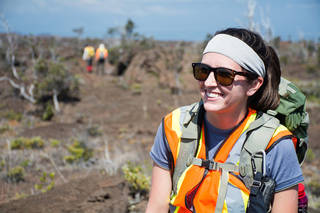 Lady in reflective gear in wilderness