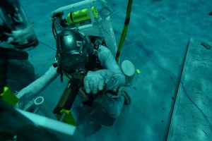 Diver under water in the Neutral Buoyancy Lab