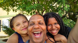 Terry Morris with his two daughters.