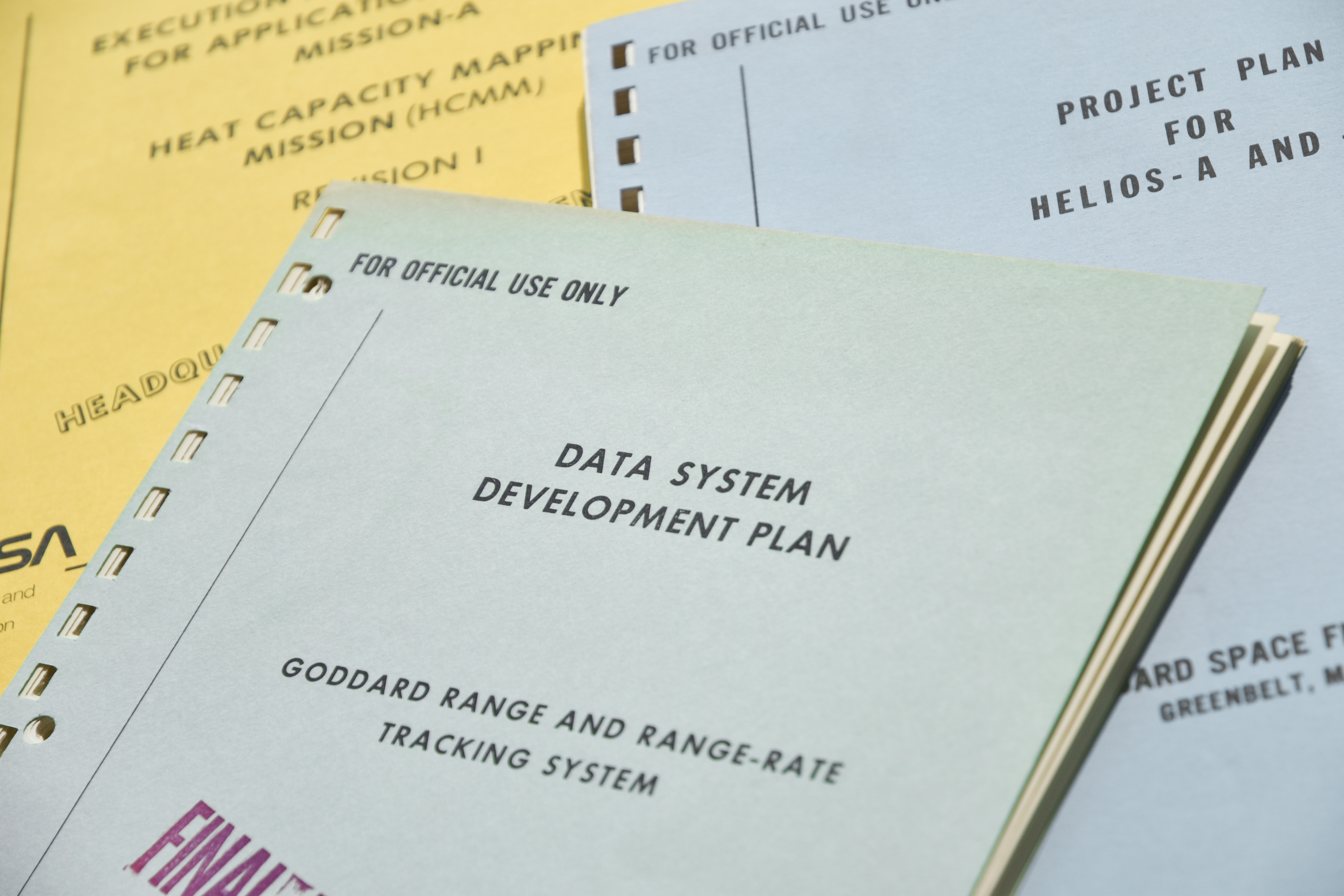 Analog and digital text-based records include program and project documentation, agency and center-level newsletters and other serials, reports, reviews, and correspondence.