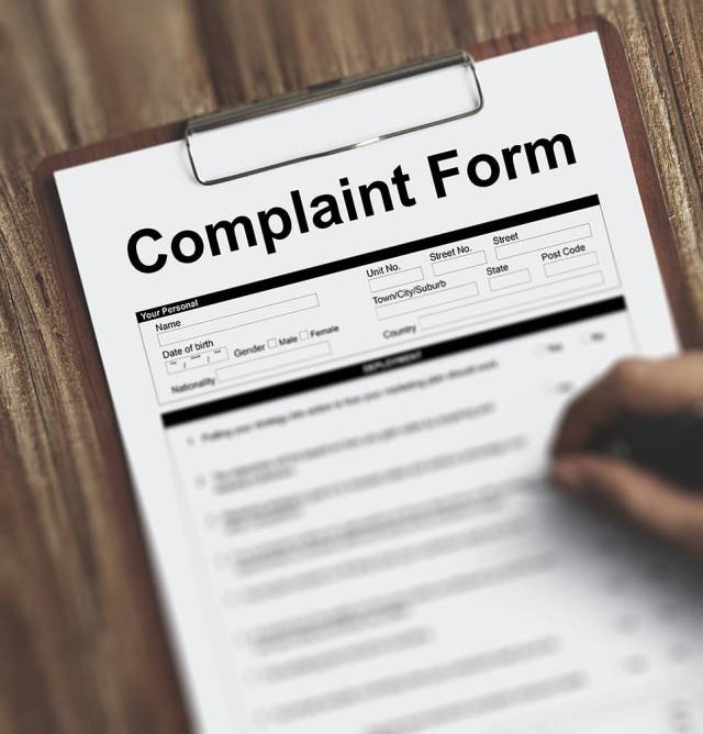 image of a paper with complaint form across the top