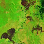 A map shows where fire spread over Brazil's Pantanal with dark brown spots over green area.