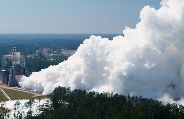 vapor clouds floating high about test stand at stennis space center