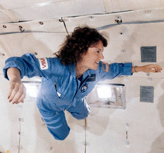 Christa McAuliffe in flight suit during zero gravity training flight