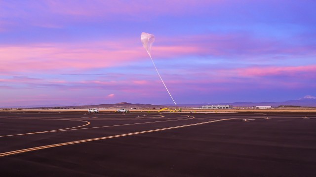 Spaceworks balloon launch against a pink and purple sky.
