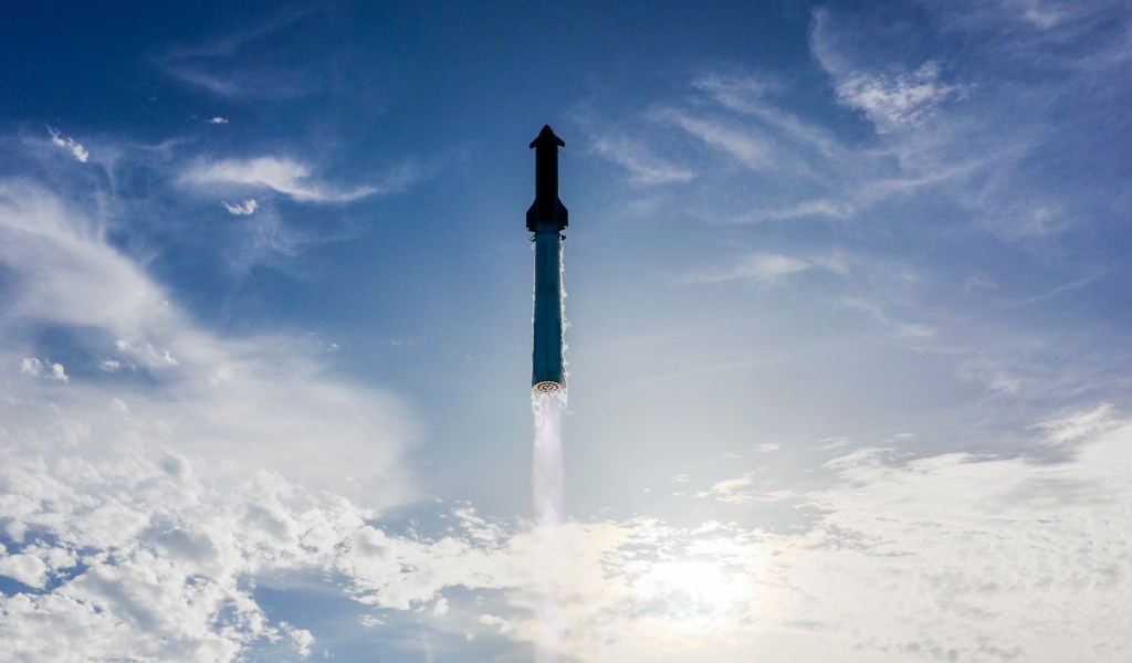 Image shows a blue sky with clouds during the liftoff of SpaceX's Starship at 6:30 p.m. CDT on Aug. 26, 2025, from Starbase, Texas. Photo credit: SpaceX