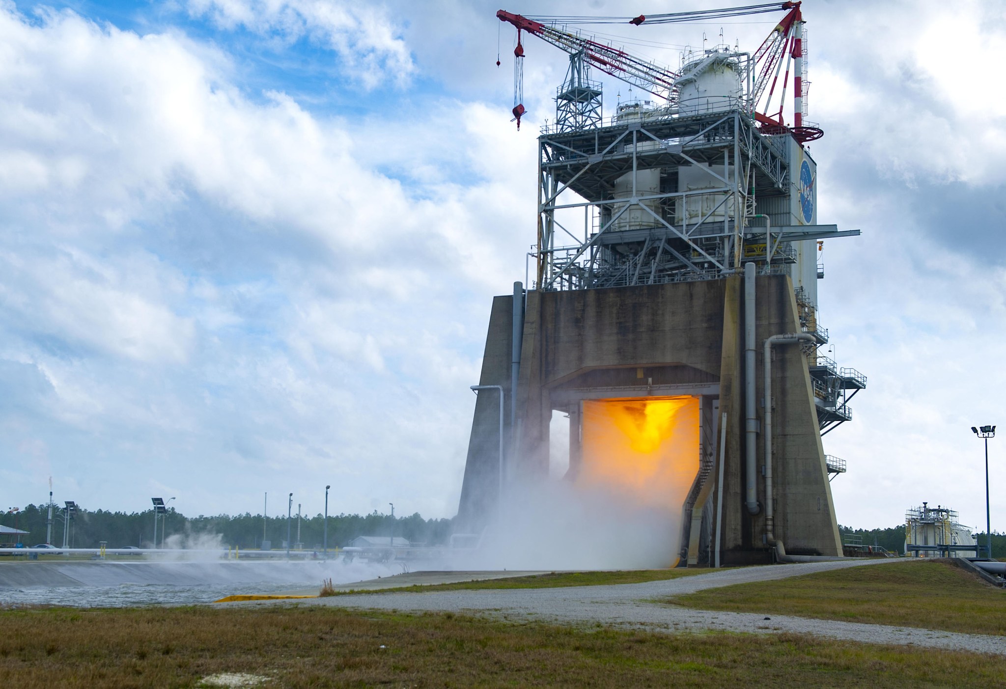 A mounted field camera offers a close-up views as NASA conducts an RS-25 hot fire test on the Fred Haise Test Stand.