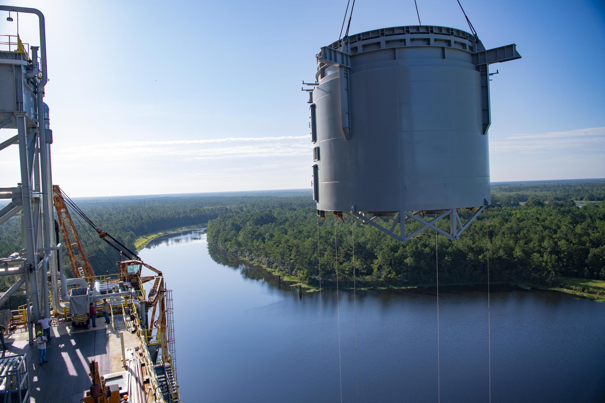 large diffusers is being lifted onto the Thad Cochran Test Stand (B-2) on December 11, 2023