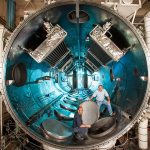 Two men in a thermal vacuum facility