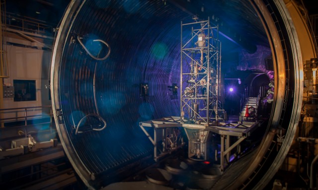 view inside the vacuum chamber lit with blue lighting.