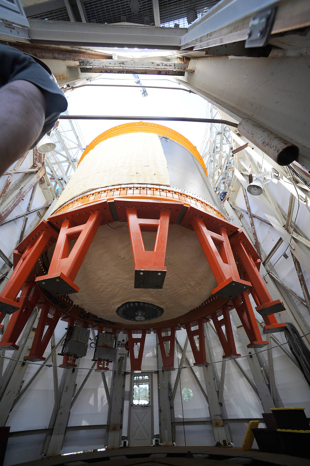 The 18-foot-diameter composite cryotank is lowered into a Marshall Space Flight Center structural test stand. 