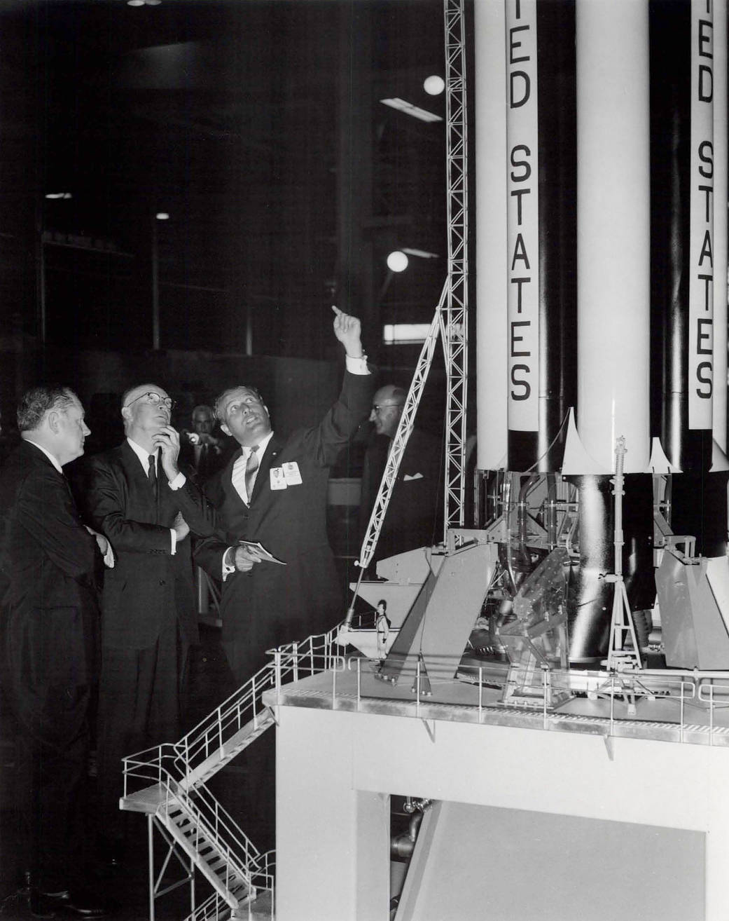 Dr. Wernher von Braun, Marshall’s first center director, shows President Dwight D. Eisenhower a model of the Saturn IB as they